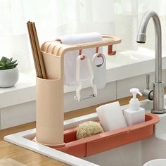 a kitchen sink with soap, toothbrushes and other bathroom items in the holder