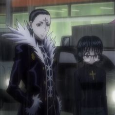 two anime characters standing next to each other