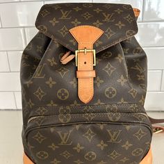 Authentic Lv Backpack Used Only A Handful Of Times! Wear Is Minimal But Shown In Photos. Paid Over $3000 For It Brand New. Luxury Brown School Bag, Designer Brown Backpack For School, Classic Brown Monogram Canvas Backpack, Designer Brown Backpack, Luxury Brown Backpack For School, Designer Brown Bag For School, Designer Brown School Bag, Luxury Brown School Backpack, Designer Brown Backpack With Adjustable Strap