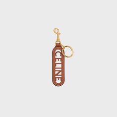 PERFORATED CELINE KEYRING CHARM IN SMOOTH CALFSKIN - TAN | CELINE Fragrance Bottle, Key Pouch, Handbag Charms, Key Design, Vintage Branding, Leather Key, Nice Leather, Design Consultant, Small Leather Goods