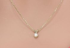 14k Solid Gold Dainty Pearl Necklace, Real Gold Natural Pearl Necklace, Premium Necklace For Her. All of the materials including pendant and chain are 14k Solid Gold. It's dainty and sturdy.  Dimensions - Chain width: 1.20 mm.  Pendant Width: 3.8 mm.  Pendant Height: 7.8 mm. 💙 Our jewelry is handcrafted with love and great care at San Francisco Bay! All of our items are 14k stamped for authenticity. 💙 You will receive them exactly as pictured. We don't use any filters, all photos are authentic and unedited. 💙 The material is 14k solid gold and should not be confused with gold plating or filling. It won't tarnish or fade over time. 💙 Our chain is a special diamond cut chain with 1.20 mm thickness. It's dainty and sturdy. We're offering the finest quality in solid gold jewelry. 💙 Quick 14k Gold Necklace With Bail For Gift, White Pendant Necklace With Bail, Round Pendant Necklaces With Bail For Anniversary, Pearl Necklace Real, Alexandrite Jewelry, Dainty Pearl Necklace, Natural Pearl Necklace, Real Pearl Necklace, Necklace For Her