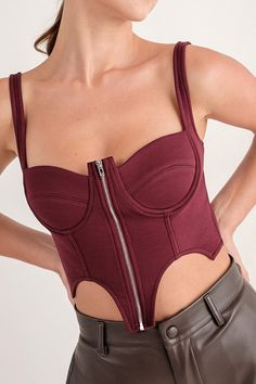 Bustier crop top Maroon Sweetheart neckline Sleeveless Zipper enclosure on front 70% Rayon + 22% Nylon + 8% Spandex Non-sheer Stretching Fit: true to size Model Specs Arzoo is wearing a SMALL. Height: 5'4 Size: 2/4 Cheap Stretch Bustier Crop Top, Cheap Seamless Bustier Crop Top, Affordable Seamless Bustier Crop Top, Fitted Underbust Crop Top For Night Out, Fitted Low-cut Tank Top With Built-in Bra, Fitted Crop Top With Boned Bodice, Fitted Cropped Crop Top With Boned Bodice, Fitted Crop Top With Built-in Bra And Underbust Design, Fitted Boned Bodice Crop Top For Club