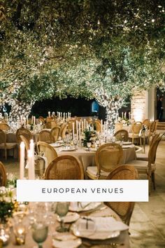 an outdoor dining area with tables and chairs set up for dinner, surrounded by greenery