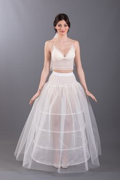 Petticoat is a quality petticoat that you can choose to make your wedding dresses look fluffy. Please contact us to take advantage of the wholesale purchase opportunity.. LF-214 ELASTIC GIRDLE Circuit: 210cm Height: 105cm Hoops: 4pcs Sewed Cord Please do not forget to visit our website to see our products that we offer unique models to thousands of customers... www.kynpetticoat.com Affordable Fitted Wedding Petticoat, White Fitted Petticoat For Debutante Ball, Fitted Crinoline Petticoat For Debutante Ball, Stretch Crinoline Petticoat For Wedding, Wedding Petticoat In Stretch Crinoline, Fitted Tulle Petticoat For Wedding, Fitted Wedding Petticoat With Attached Cancan, Wedding Petticoat With Attached Cancan, Fitted Lace Petticoat With Attached Cancan