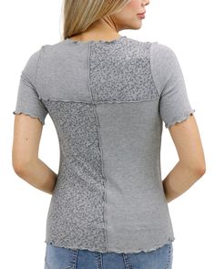 Heathered Grey Patched Ribbed Knit Tee | Grey Ribbed Tee Introducing the Patched Ribbed Knit Tee - your new favorite go-to for the season! Comfy and flattering, this stretchy knit tee features a ribbed knit fabric with a tonal heathered grey floral patchwork pattern that keeps your look elevated whether you dress it up or down! Why you’ll love it: Stretchy, short sleeved, patched, ribbed knit tee in heathered grey Feminine lettuce trim along sleeves, neck, and hemline Eye-catching tone on tone d Fitted Textured Knit Top For Layering, Gray Stretch Textured Knit Tops, Stretch Textured Knit Tops For Layering, Gray Stretch Knit Top For Spring, Stretch Pointelle Knit Tops For Layering, Gray Stretch Tops With Ribbed Neckline, Gray Textured Knit Crew Neck Top, Casual Gray Pointelle Knit Top, Ribbed Tee