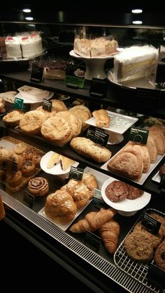 there are many different types of pastries in the display case