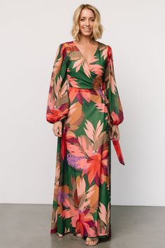 True wrap style for your every vacay need Green with multicolor tropical floral print Chiffon material that flows beautifully True wrap style with waist tie Flattering surplice neckline Long sleeves with elastic cuffs Maxi skirt length Fully lined, excluding sleeves Self and Lining: 100% Polyester Trina is 5'6, cup size 32D, size 2 and is wearing size S Multicolor V-neck Wrap Dress For Vacation, Tropical V-neck Maxi Dress With Vibrant Print, Summer Floral Print Wrap Dress For Vacation, Floral Print Maxi Wrap Dress For Vacation, Floral Print Wrap Dress For Vacation, Printed V-neck Wrap Dress For Vacation, Green Tie Waist Wrap Dress For Vacation, Floral Print Wrap Dress For Beach, Floral Wrap Dress For Beach