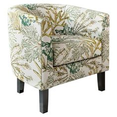 an upholstered chair with green and gold flowers on it