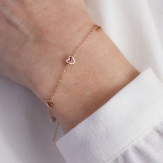 A symbol of love beyond any words. Our Valentines Chain Bracelet is a heartfelt gesture of love in jewelry form. Each bracelet features a chain of mini hearts to add a pop of romantic red and affection into any bracelet stack.&nbsp;18K Champagne Gold PlatedBracelet measures 7, adjustable to 6.3Sent with love in a complimentary gift box Yellow Gold Adjustable Chain Bracelet For Valentine's Day, Valentine's Day Yellow Gold Adjustable Chain Bracelet, Adjustable Heart Bracelet With Delicate Chain For Valentine's Day, Rose Gold Chain Bracelet For Valentine's Day, Dainty Bracelets With Adjustable Chain For Valentine's Day, Dainty Delicate Chain Bracelets For Valentine's Day, Dainty Valentine's Day Bracelet With Adjustable Chain, Dainty Adjustable Chain Bracelet For Valentine's Day, Dainty Rose Gold Bracelets With Heart Beads