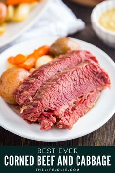 corned beef, potatoes and carrots on a white plate