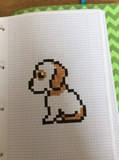 an open notebook with a drawing of a dog on it