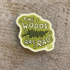 a sticker that says the woods are rad