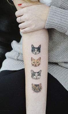 a woman's arm with four different cats on the left side of her arm