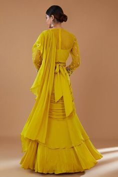 Mustard can can attached draped ruffle lehenga saree in layered silhouette, embellished by sequins. Comes with padded floral embroidered blouse and embellished belt. - Aza Fashions Wedding Traditional Wear With Ruffles In Georgette, Yellow Fitted Floor-length Pre-draped Saree, Yellow Fitted Pre-draped Saree, Yellow Wedding Gown With Ruffles, Ruffled Georgette Dupatta, Fitted Ruffled Traditional Wear For Diwali, Fitted Ruffled Georgette Dupatta, Fitted Yellow Dress With Traditional Drape, Fitted Yellow Dress With Sheer Dupatta