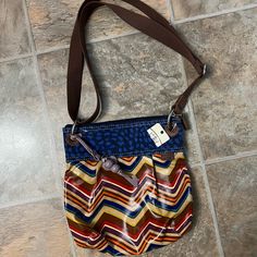 New With Tags Fossil Purse In A Fun Design. Comes With The Double Brown Strap And Light Purple Keychain. Size Is 11” X 11” #Fossilpurse #Fossil #Purse Casual Multicolor Adjustable Shoulder Bag, Blue Fossil Bag, Vintage Fossil Handbags, Fossil Heart Purse, Purple Keychain, Fossil Crossbody Bags, Fossil Crossbody, Fossil Purse, Fossil Bags