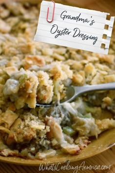 a close up of a casserole on a plate with a sign that says grandma's oyster dressing