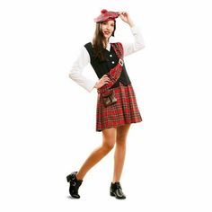 a woman in a red and black plaid kilt is posing for the camera with her hands on her hips