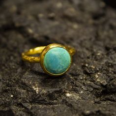 Ancient Greek Turquoise Gold Ring | Dainty Ring | Statement 925 Sterling Silver 24K Gold Plated | Handmade Ring | Christmas Gift by Pellada Our shop offer free ring sizing Handcrafted hammered ring Metal : 925 Sterling Silver Plating : 24K Gold Band Width : 2 mm Gem Stone : Turquoise Gem Size : 10*10 mm Ring Weight : 3.3 grams Ring Size : US 6 (The size you want is made for free). (We used the US standard sizing) **Custom Orders is Made** As pellada family, we will be happy to help you if you co Greek Ring, Turquoise Gem, Turquoise Gold Ring, Hammered Ring, Zierlicher Ring, Gold Armband, Greek Jewelry, Gem Ring, Turquoise Rings