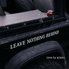 a can of soda is sitting in the back of a truck's seat area