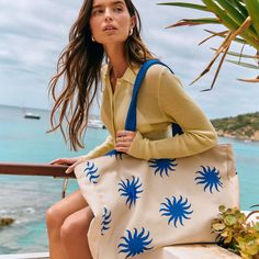 Be the ultimate goddess with BURGA's Beach Bag. Imagine strutting down the beach, bag in hand, catching everyone's eye with its vibrant patterns and luxe look. It's roomy enough to fit all your essentials (and then some), but sleek enough to make a fashion statement. Whether you're hitting up a tropical paradise or just lounging by the pool, this bag screams style, sass, and totally you.    Features:     Dimensions: 50 x 11 x 35 cm (19.7 x 4.4 x 13.8 inches)     Made from durable canvas: 35% cotton and 65% polyester.     Secured with magnetic fasteners.     Interior pocket for phone, keys, and small items.     Spacious design for all your essentials.     Part of our exclusive Resort Collection.     Care Instructions:     Spot clean with mild soap and water.     Hand wash with cold water an Large Capacity Canvas Bag For Summer Vacation, Sand-colored Shoulder Bag For Summer Travel, Trendy Summer Canvas Bag With Adjustable Strap, Canvas Vacation Bag, Summer Beach Shoulder Bag With Removable Pouch, Beach Shoulder Canvas Bag, Summer Shoulder Beach Bag With Removable Pouch, Trendy Double Handle Bags For Beach Season, Summer Beach Bag With Removable Pouch, Rectangular