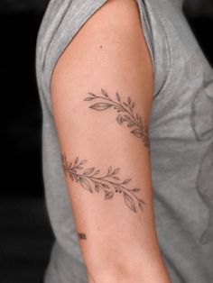 a woman with a flower tattoo on her arm