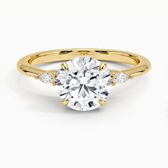 Nadia with 1.5ct Round Certified Lab Diamond Engagement Ring - 18K Yellow Gold. Shimmering, elegant, and ready to ship, this ring features a dazzling cluster of round and marquise-shaped lab diamonds and a gently tapered band with a curated 1.5 carat round lab diamond center stone included (1/10 side stone ct. tw.).

 This center diamond is certified for authenticity by an independent grading lab and inscribed with a number that matches its certificate. Classic Diamond Engagement Ring, Most Popular Engagement Rings, Popular Engagement Rings, Lab Diamond Engagement Ring, Round Cut Engagement Rings, Lab Grown Diamonds Engagement, Classic Engagement Rings, Yellow Gold Setting, Halo Diamond Engagement Ring