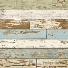 an old wood plank wallpaper with blue and white paint on the bottom half of it