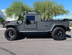 a large gray truck parked in a parking lot