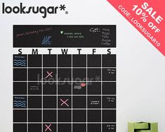 a black and white wall calendar with the words smtwees written on it