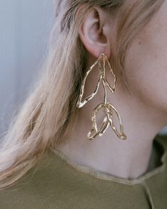 Beloved Bloom Earrings in Gold – Closed Caption Metal Chandelier Earrings, Leaf-shaped Metal Jewelry For Party, Modern Metal Earrings For Spring, Metal Leaf-shaped Jewelry, Leaf-shaped Metal Party Jewelry, Elegant Leaf-shaped Metal Earrings, Leaf-shaped Metal Earrings For Party, Pierced Leaf-shaped Metal Earrings, Trendy Metal Flower Drop Earrings