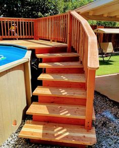 an above ground pool with steps leading up to the deck and above ground hot tub