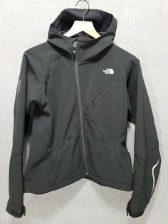 The North Face Recco Apex Womens Jacket Size Small Black White Hooded   Size: Small     Actual Measurements:                                   - Armpit to Armpit: 19”                                                   - Neck to Front Hem: 19”   - Back Neck to Bottom Hem: 23”   - Neck Hem to Cuff Hem: 29”   Color: Black, White Features:Bottom of Form ·       Hood ·       3 Front zippered pockets ·       Cinch string in bottom hem ·       1 Zippered inside pocket ·       Velcro adjustable cuffs · The North Face Fall Streetwear Hooded Jacket, The North Face Hooded Jacket With Detachable Hood, The North Face Hooded Jacket For Streetwear, The North Face Hooded Streetwear Jacket, The North Face Outerwear With Adjustable Hood For Streetwear, The North Face Hooded Jacket With Pockets, The North Face Urban Hooded Outerwear, The North Face Streetwear Outerwear With Adjustable Hood, Urban Hooded Outerwear By The North Face