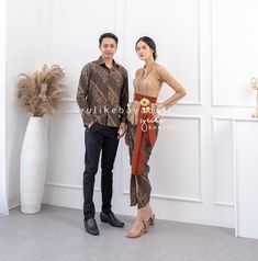 Kebaya Couple set | full set of kebaya dress and men's batik shirt, sarimbit batik couple, long sleeve and V-neck Couple Set : Kebaya+Shawl+Batik skirt+men's batik shirt Semi Italy Couple Set Flower Ice Coffee | Sarimbit Batik Couple Button kebaya, front hook Kebaya Size : S Bust 84cm M Bust 88cm L Bust 92cm XL Bust 96cm 2XL Bust 100cm 3XL Bust 104cm Skirt size S Hips 85cm M Hip 90cm L Hip 95cm XL Hip 100cm 2XL Hip 105cm 3XL Hip 110cm   Skirt length = ± 90cm Men's Batik shirt size S Bust 105cm M Formal Long Sleeve Sets With Traditional Patterns, Fitted Batik Print Long Sleeve Sets, Fitted Long Sleeve Batik Print Sets, Traditional Long Sleeve Sets With Batik Print, Batik Skirt, Flower Ice, Batik Couple, Kebaya Dress, Couple Set