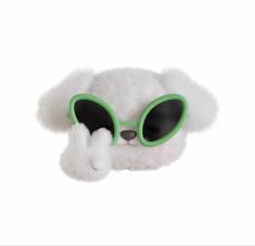 a white teddy bear wearing green goggles on its head and nose with black eyes