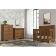 a baby crib and dresser in a room