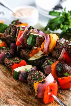 steak kabobs on a cutting board with the title easy steak kabobs