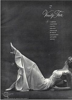 a woman laying on the ground with her legs spread out, wearing a white dress