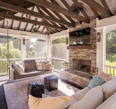 a living room filled with furniture and a fire place