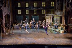 a group of people standing on top of a stage