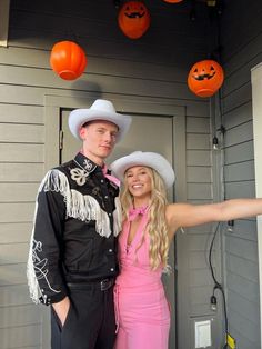 a man and woman dressed up in costumes