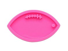 a pink tray with a football shaped plastic object in the shape of a ball on it