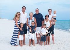 a family posing for a photo on the beach