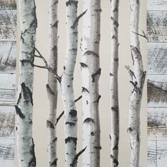 an image of birch trees painted in black and white on wood planks by the wall