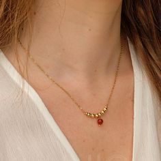 Gold Chain Necklace with Delicate Genuine Carnelian gemstone, handmade with Love in our studio. This elegant gold chain necklace showcases polished golden beads, ending with a vibrant red carnelian bead. Its simple design ensures versatility, making it a charming addition to any outfit. M A T E R I A L S * Genuine Carnelian gemstone * High quality Stainless steel for a waterproof wear * Coated with a thick layer of 18k gold (2micron) - PVD coating technique * WATERPROOF: The color remains perfec Golden Beads, Pvd Coating, Red Carnelian, Carnelian Necklace, Carnelian Beads, For Her Gifts, July Birthstone, Birthday Gift For Her, Gold Chain Necklace