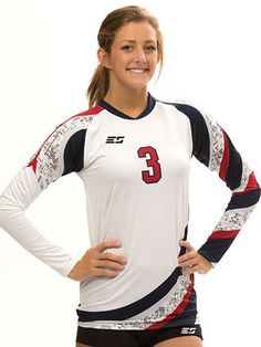 a female volleyball player is posing for a photo with her hands on her hips and smiling at the camera