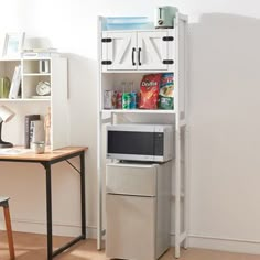 a microwave is sitting on top of a bookcase next to a desk and chair