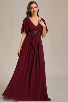 Elevate your evening with our Elegant Chiffon Applique Evening Dress. The flutter sleeves add a touch of grace to the A-line silhouette, while the empire waist defines your figure and enhances your curves. The delicate applique detailing on the chiffon fabric exudes sophistication and charm. Whether you're attending a gala or a special event, this dress is designed to make you feel confident and radiant, capturing attention with every step you take. Fit: Please refer to size chart. Length: Floor length. Sleeve Style: Short sleeves. Closure: It is concealed a zipper up the back. Undergarments: It is not padded, with lining. Fabric:The garment comprises chiffon. Stretch: Fabric is no stretch. Infinity Gown, Prom Dresses Burgundy, Formal Bridesmaids Dresses, Floor Length Chiffon Bridesmaid Dresses, Burgundy Bridesmaid Dresses, Maxi Dress Evening, Bridesmaid Gown, Formal Evening Dresses, Evening Dresses Prom