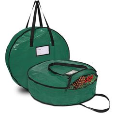 a large green bag with pine cones on the inside and an attached strap to it