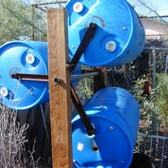 two large blue barrels sitting next to each other