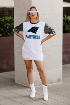 Elevate your game day look with our Carolina Panthers full sequin jersey tunic dress. Designed with sports striping details on the sleeves and a lightweight garment lining, it ensures both style and comfort. Whether you're cheering from the stands or watching from home, rock your favorite school or team in standout fashion. Sequin Jersey Dress, Sequin Jersey, Carolina Panthers, Jersey Dress, Tunic Dress, Game Day, From Home, Sequin, Sports